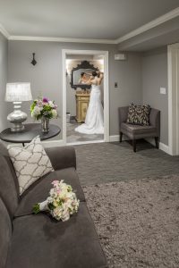 bridal suite with couch and flowers.